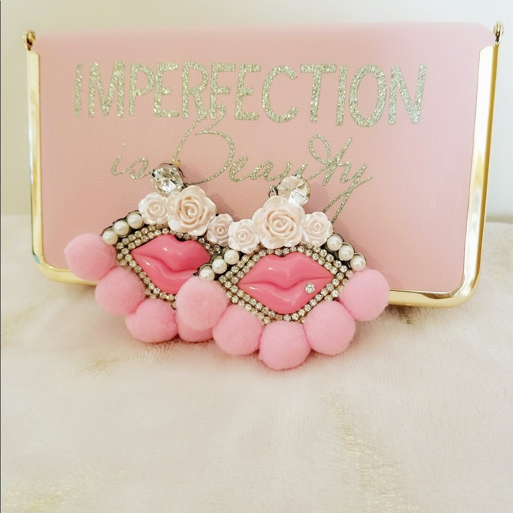 Pink lip with pink pom pom earrings